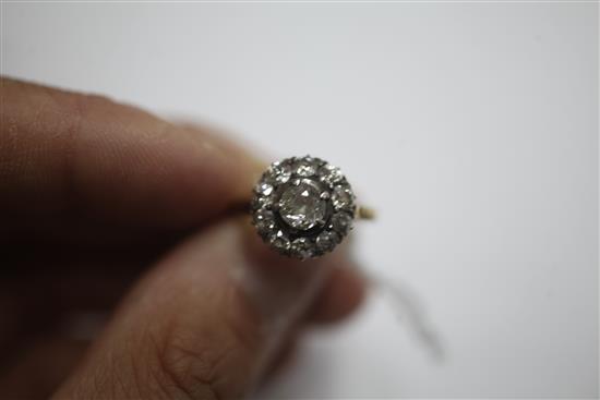 An early 20th century 18ct gold and diamond cluster ring, size K.